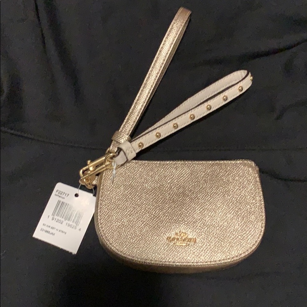 Coach wristlet with two strap sets